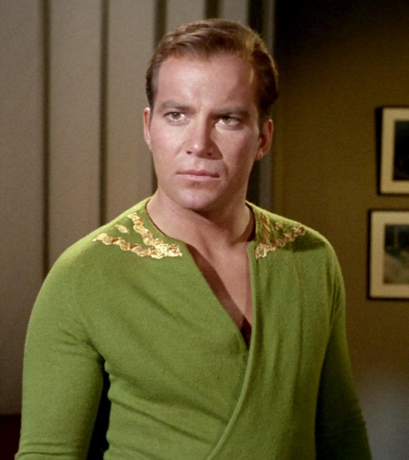 Why is Captain Kirk wearing a green wraparound tunic?As the costumes changed fabrics, how they appeared when film changed. Supposedly, the pullovers were also greenish. (But that doesn't make sense with the rank gilding around the neck?)