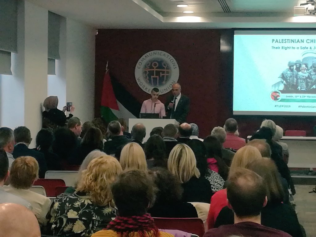 ipsc48's tweet photo. Ahmed, a 17-year-old Palestinian former child prisoner speaks to a room full of trade unionists about his horrendous ordeal when he was arrested and jailed by Apartheid Israel's occupation forces. Now free, he's just passed his exams! #childrensconference #tufp2019 https://t.co/QQqlM1GZpl