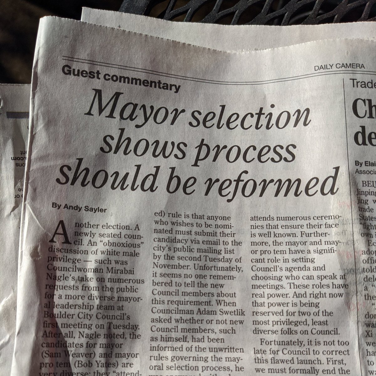 Photo of a print copy of the Daily Camera featuring an op ed by this author.