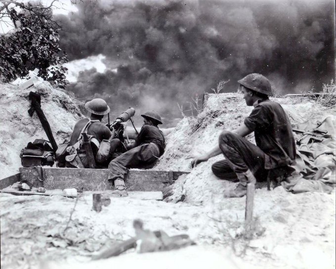 Australian gunners of the 8th Infantry Brigade/7th #Australian Division at work in #Borneo, July 2, 1945. 

#WWII #WW2