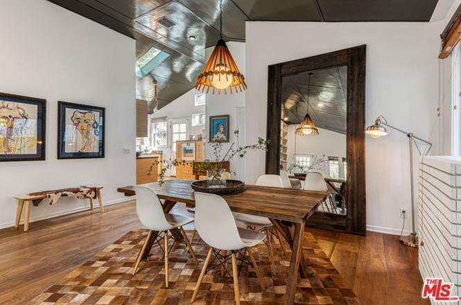 Look at this amazing cottage with its dark grey exterior and glossy black cathedral ceiling and weird swing thing and cool floor-to-ceiling custom bookshelf. I feel uncool just looking at it because this house is so much cooler than me.It's asking $4.65M  https://www.redfin.com/CA/Venice/812-Amoroso-Pl-90291/home/6743703