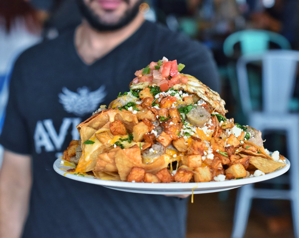 The undisputed nacho boss of Baltimore drops another brunch banger; home fries and tortilla chips piled high w maple sausage, egg, pico, jalapeño, black bean purée and queso.