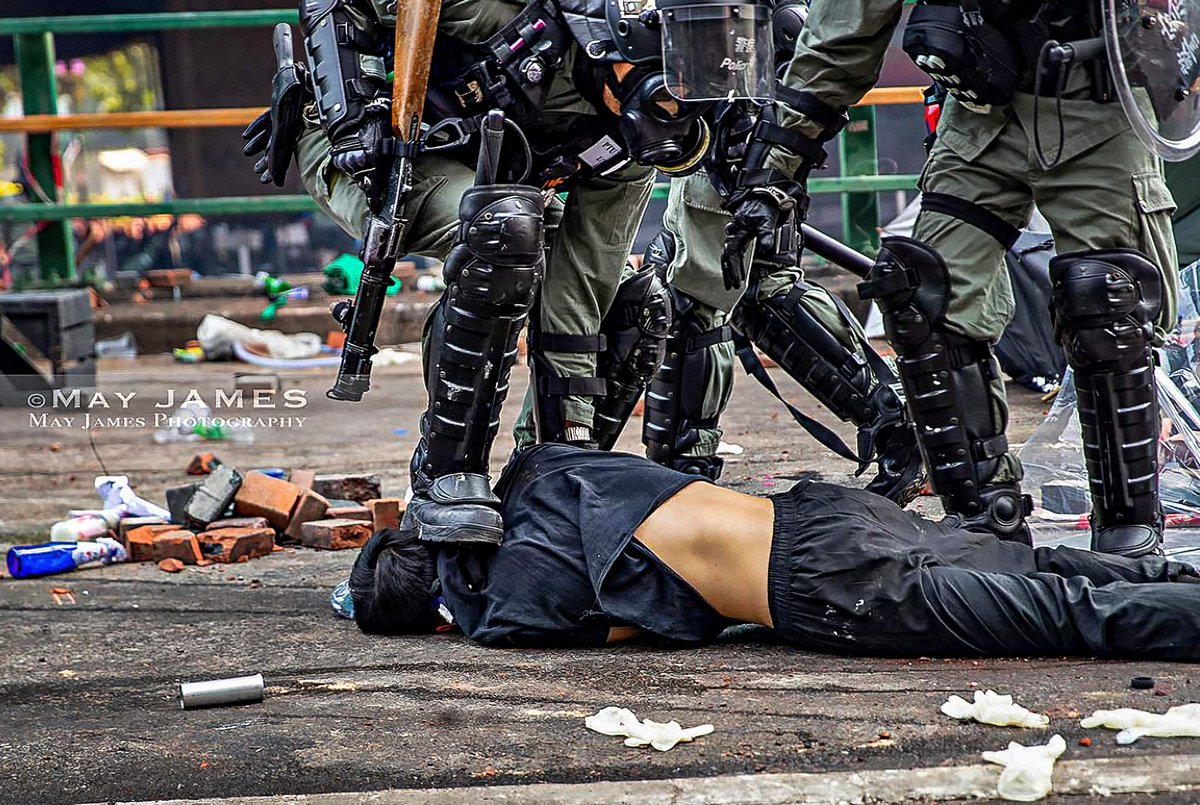VerbatimHKG's tweet photo. In light of the election, a photo to remind us why #HongKong needs democracy:
Riot police in full gear stomped on the head of a harmless demonstrator.
This is the epitome of the violence imposed on #HongKonger each day. https://t.co/CyS8Wl7c2n