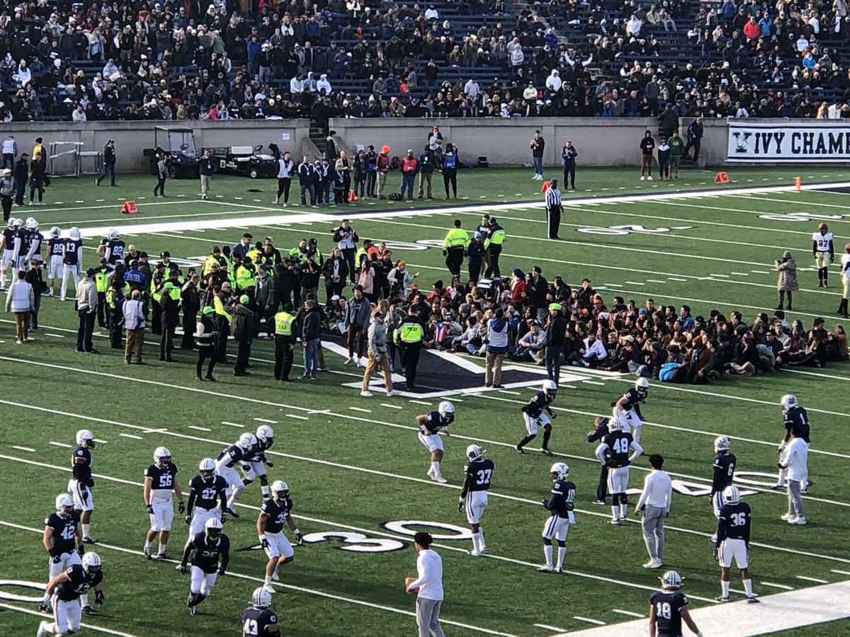 daniel_juarez's tweet photo. Yale and Harvard students rush field at halftime to sit-in to demand devestment in Puerto Rico debt and to combat climate change. https://t.co/pTUShj8mOQ