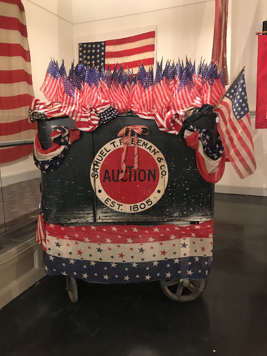proberts49's tweet image. A panoply of #paradeflags ⁦@FreemansAuction⁩ today disguises the original auctioneers rostrum(Stand in the U.S.) in use by Beau Freeman the first moment I set foot in 1808 Chestnut St 24 years ago