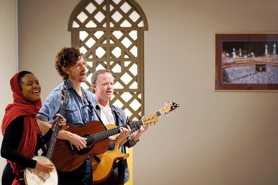 Birds of Chicago members, from left, Allison Russell, JT Nero and Steve Dawson perform their “American Flowers” song at the Islamic Center of Greater Toledo in Perrysburg, Ohio, on Saturday.