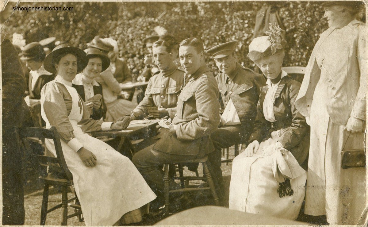 British soldiers and a nurse enjoying cards. The photographer is in Hastings.
