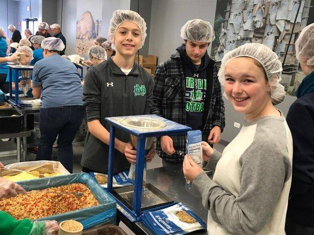 nddons's tweet image. Earlier this month, our Parents Association packed ~150 Blessing Bags for Catholic Charities. And last Saturday, Dads Club prepared meals at Feed My Starving Children. Thanks to all the parents and families who participated in these projects! #CoreValuesinAction #WeAreHolyCross