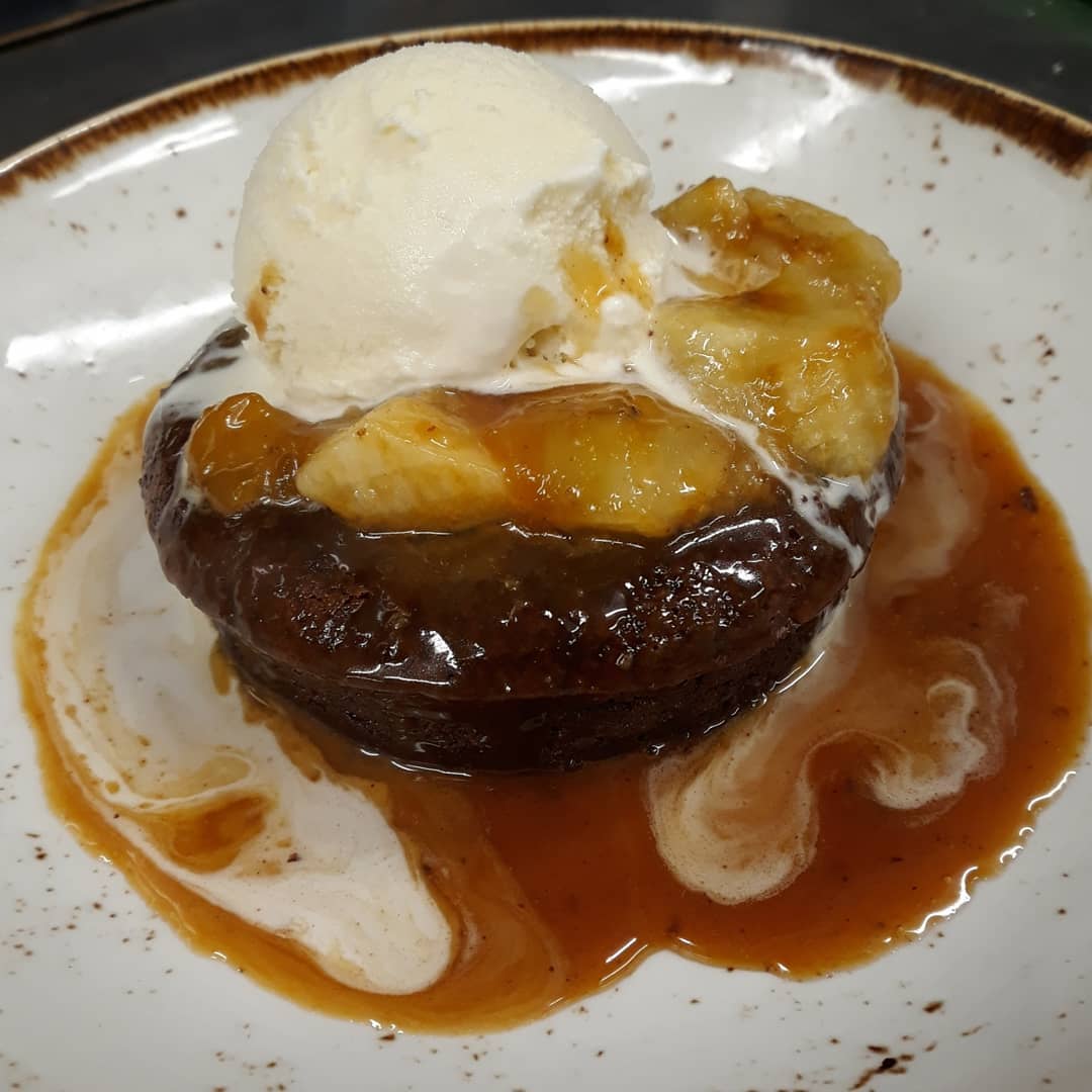 Our idea of Sunday Funday: Dessert for dinner. You have to try our Warm Chocolate Brownie Custard with a banana rum caramel sauce! 🍌📸| @aaaejr