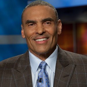 Coach Herm Edwards & (Wife) Lia Edwards 