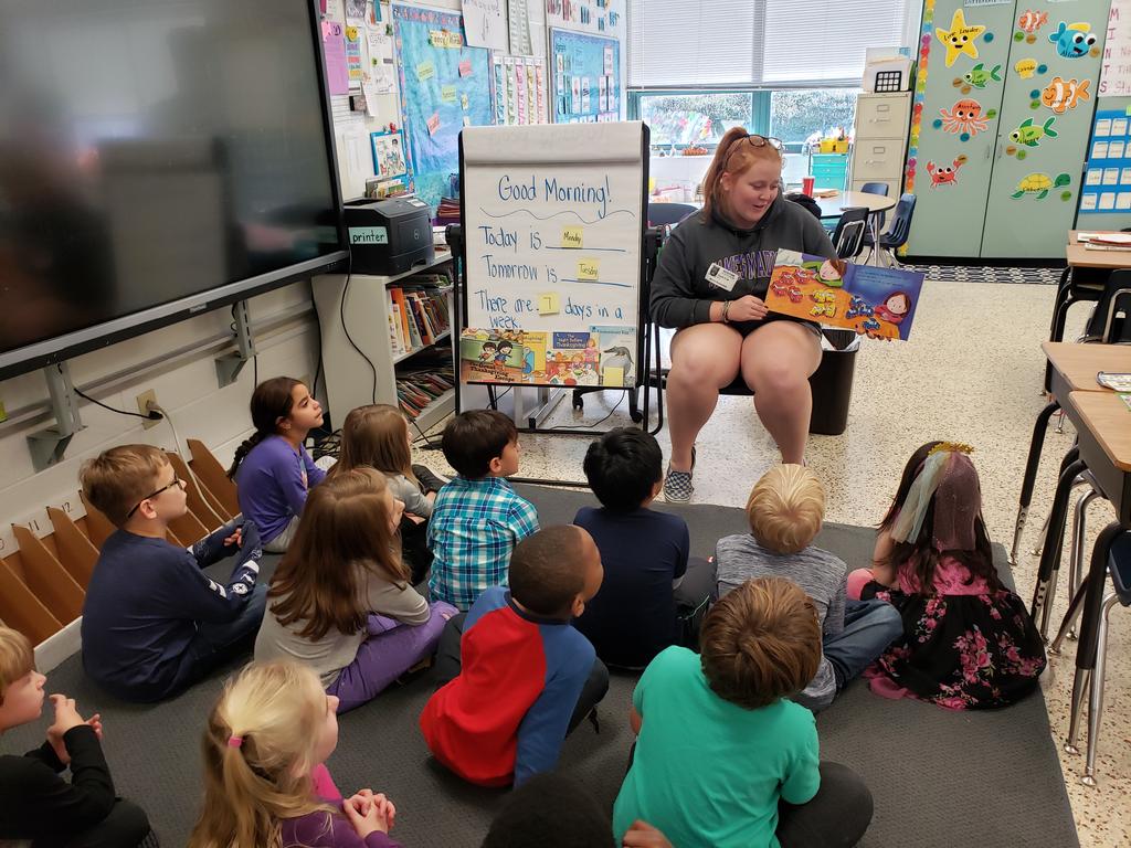 Special visitor in our class today! Home from college and put to work. Ms. Cole's daughter, Sarah, read us a book and then answered lots of our questions about playing the flute in marching band at JMU.💜💛 <a href="/MalibuESVB/">Malibu Elementary</a> #WeSwim2gether