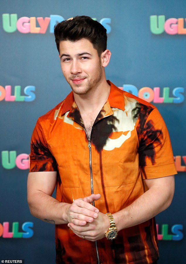 Nick Jonas in orange