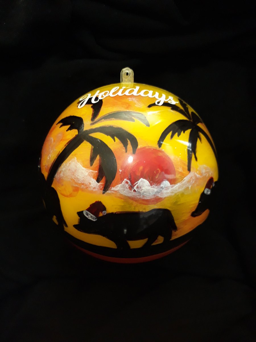 water buffalo of Guam, also called carabao, in silhouette with santa hats on; palm trees around them and a sun and clouds above; on a yellow background 