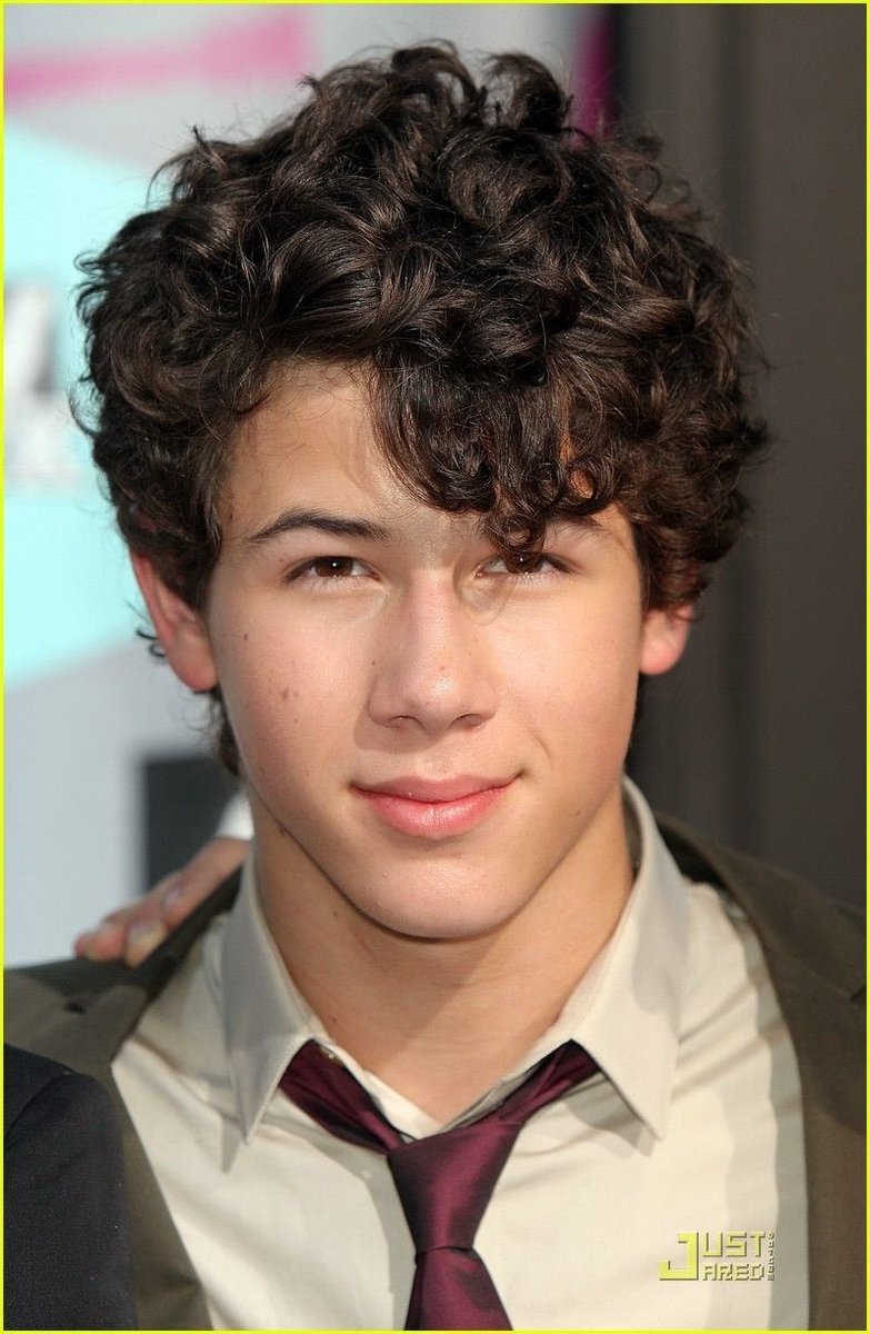 Nick Jonas with curls