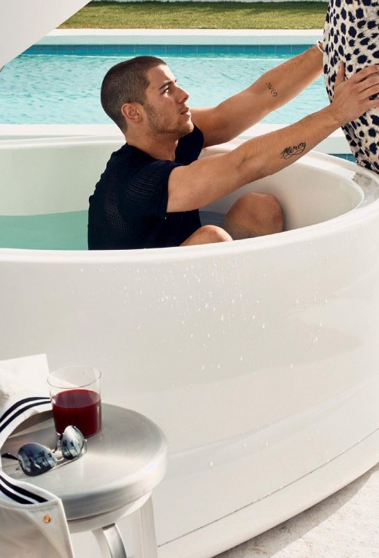 Nick Jonas in a bathtub