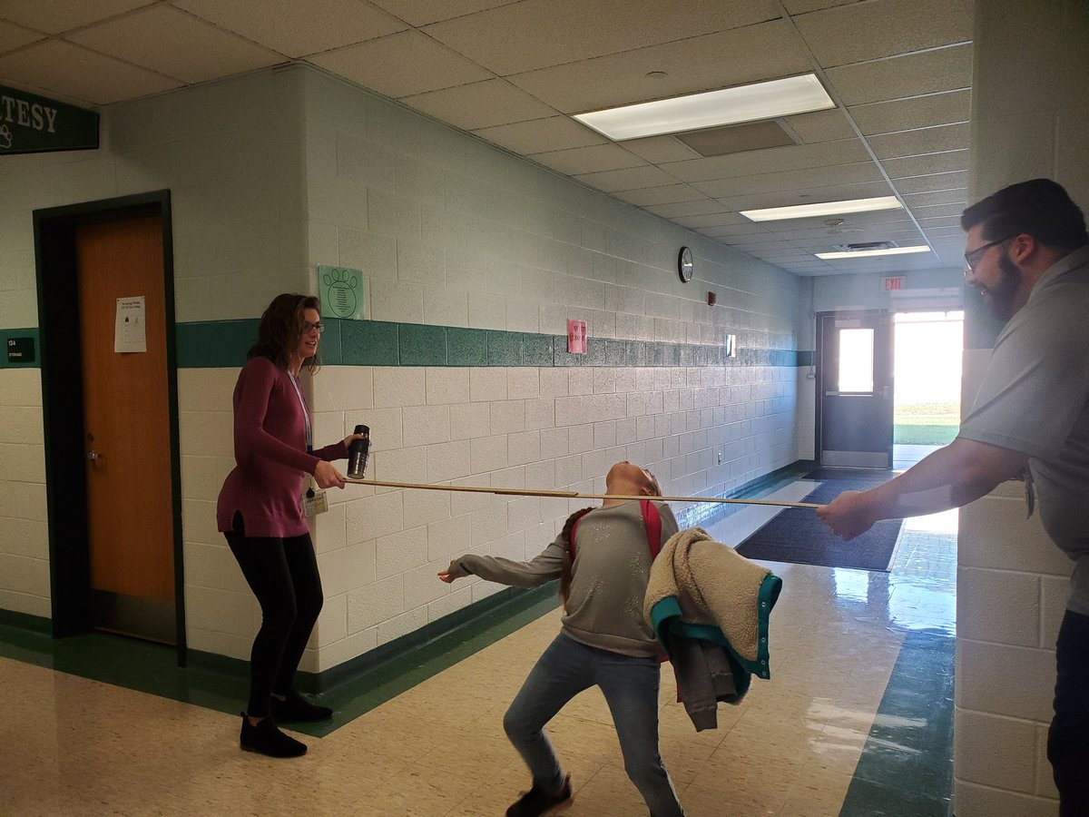 MrBirdCH's tweet photo. Students and staff doing the limbo on their way into school today! #limbo @MrsLarca @CopperHillES https://t.co/pdVBLRhzOF