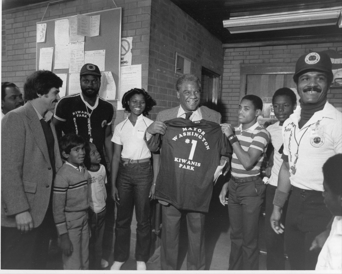 Mayor Washington visiting the far northside and Kiwanis park where my godfather (far right) presented Harold with a tshirt.