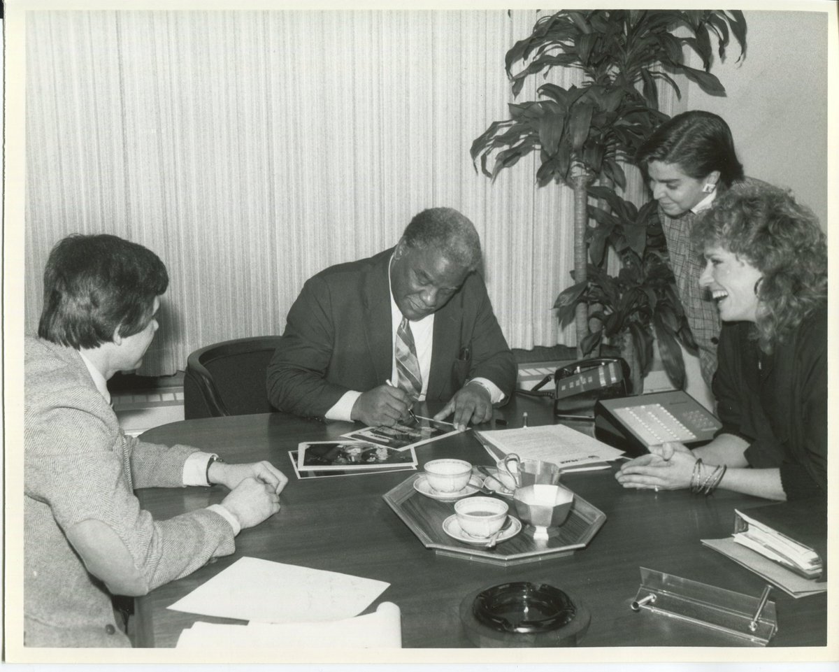 Harold signing pictures for supporters.