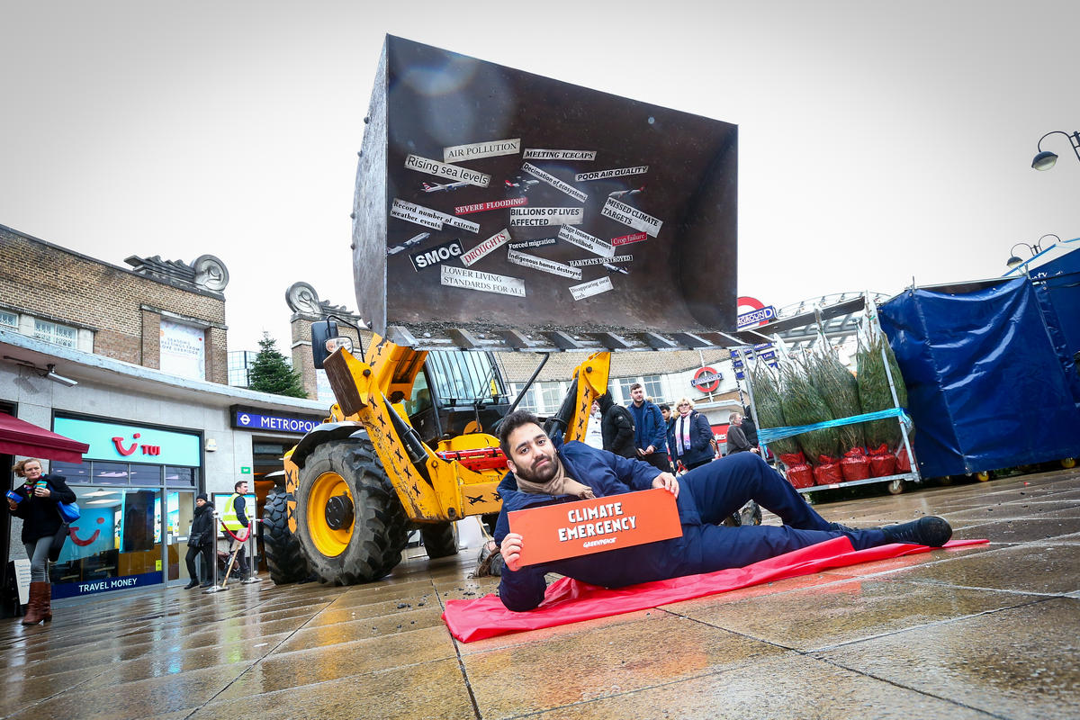 GreenpeaceUK's tweet photo. Big thanks to @UKLabour Uxbridge candidate @ARMilani_ for doing what @BorisJohnson promised but failed to do - lie down in front of a bulldozer to stop the construction of a 3rd runway at Heathrow. #nothirdrunway in a #ClimateEmergency https://t.co/KzOsK5nZkp