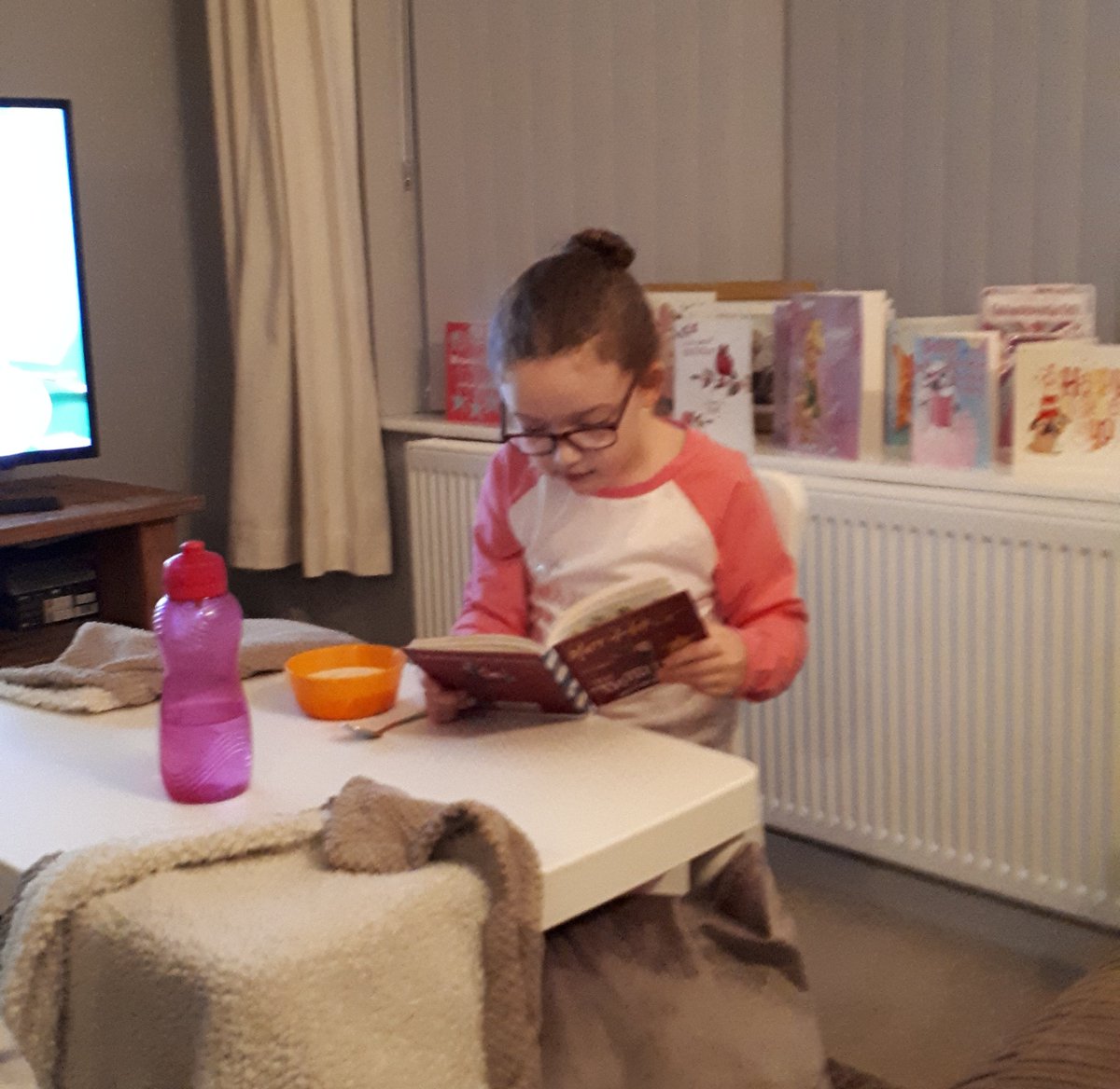 JessNug2011's tweet photo. Love this! Our little bookworm. Reading one of her 7th birthday presents while eating breakfast #bookworm #lovesreading #truthpixie @GarswoodPrimary @matthaig1 @MrsRollason @MissJenkinson @chloe6bloor @nuggylad https://t.co/yOF667be5w