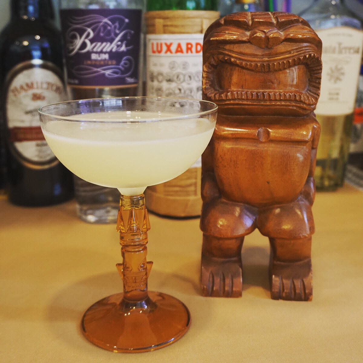 therumtrader's tweet photo. Beachcomber coxktail in new Libbey Tiki coupe.
Banks 5, lime, Triple Sec, Luxardo; Shake & strain
@Banks_Rum @LUXARDOUSA @LibbeyInc #rum #ron #rhum #drinkmorerum #drinkwell #drinkstagram #cocktialculture #homebartender #rumisfun #rumtime #rumlove #tikiglass #tikitime https://t.co/A67LctEU40