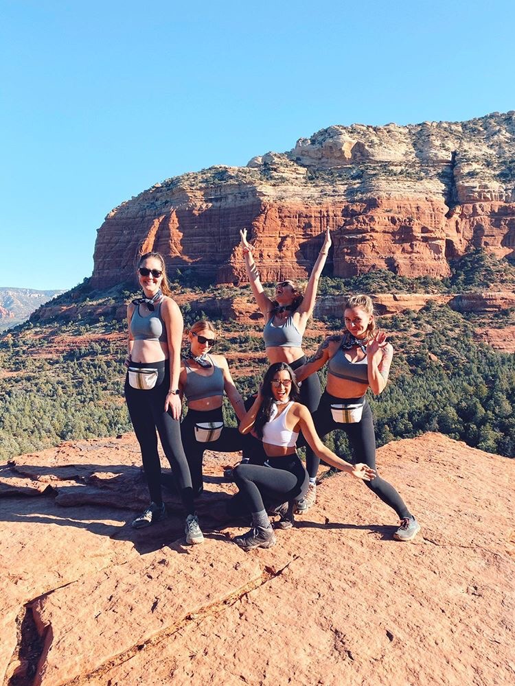 Jules Hunt and all her girls geared up in mini hip packs for the ultimate bachelorette weekend in Sedona! ⁠
⁠
#alohacollection #splashproof #travellightwithus