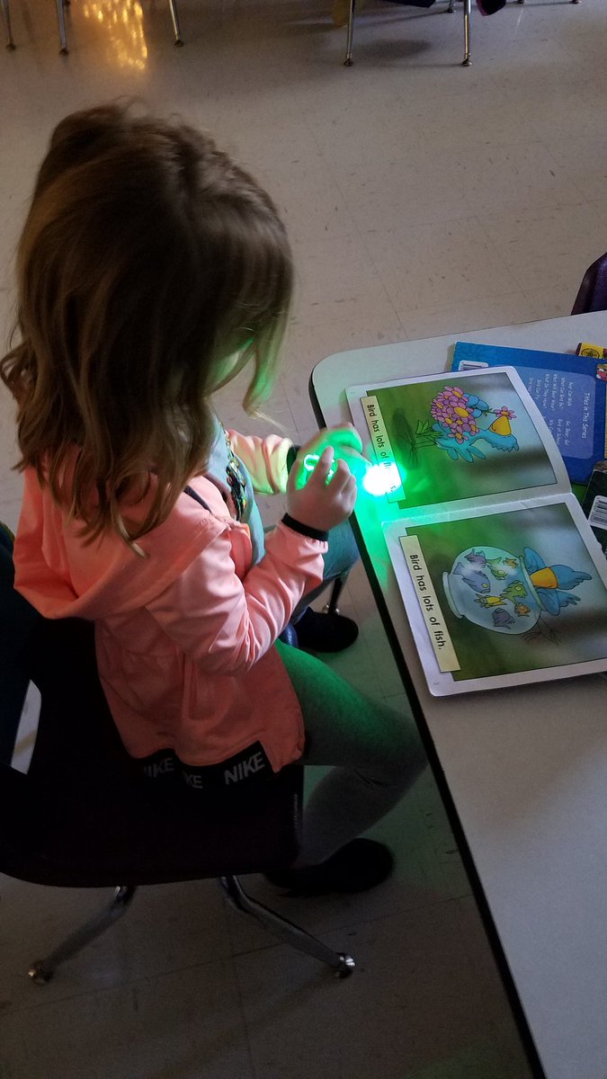 Kindergarten Reading by the campfire for Flashlight Friday on Tuesday