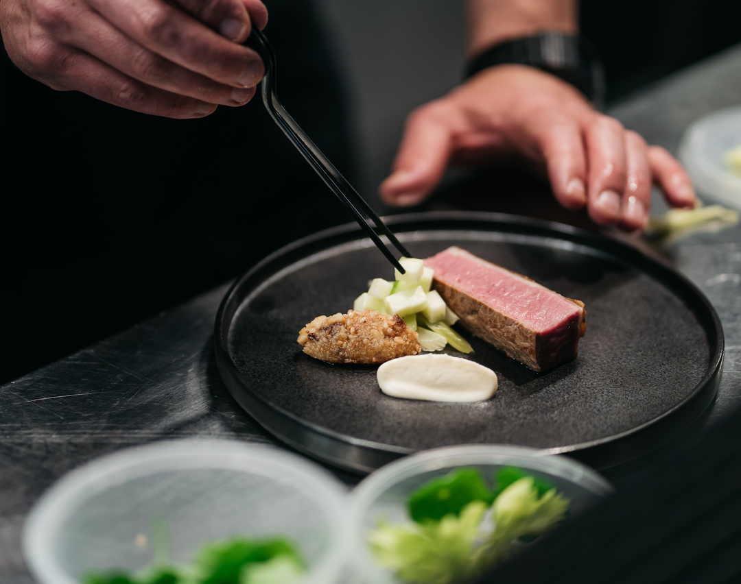 Precise preparation in the @_dootdootdoot  kitchen plating the fourth course. 
​#TastingMenu