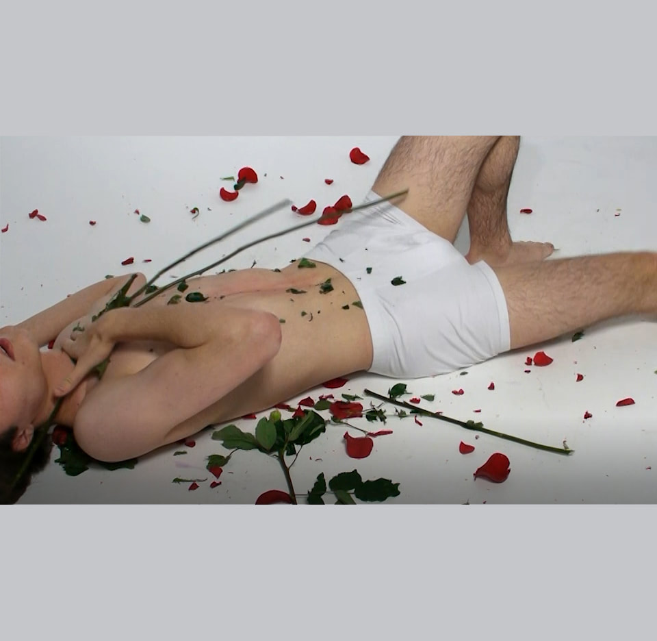 Giving & Receiving, Mac Lewandowski, PL 2019, 1'30''​Camera performance based on translating delicacy into pain. A bouquet of roses symbolising love given on becomes a whip in the context of expectations imposed on a man. Contrast undermines established social gender roles.