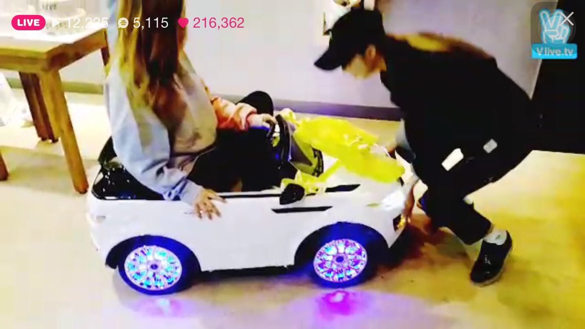 moonsun pushing wheein around in a lil car she got as a gift