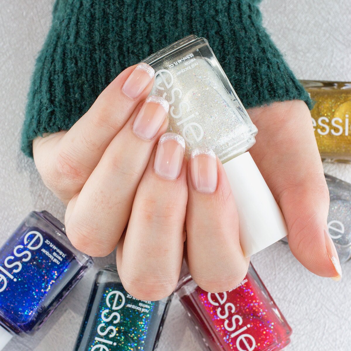 Sparkly French mani using <a href="/essie/">essie</a> Let it Bow, new from the Essie Winter 2019 collection. How festive are these shades? 😍🎄