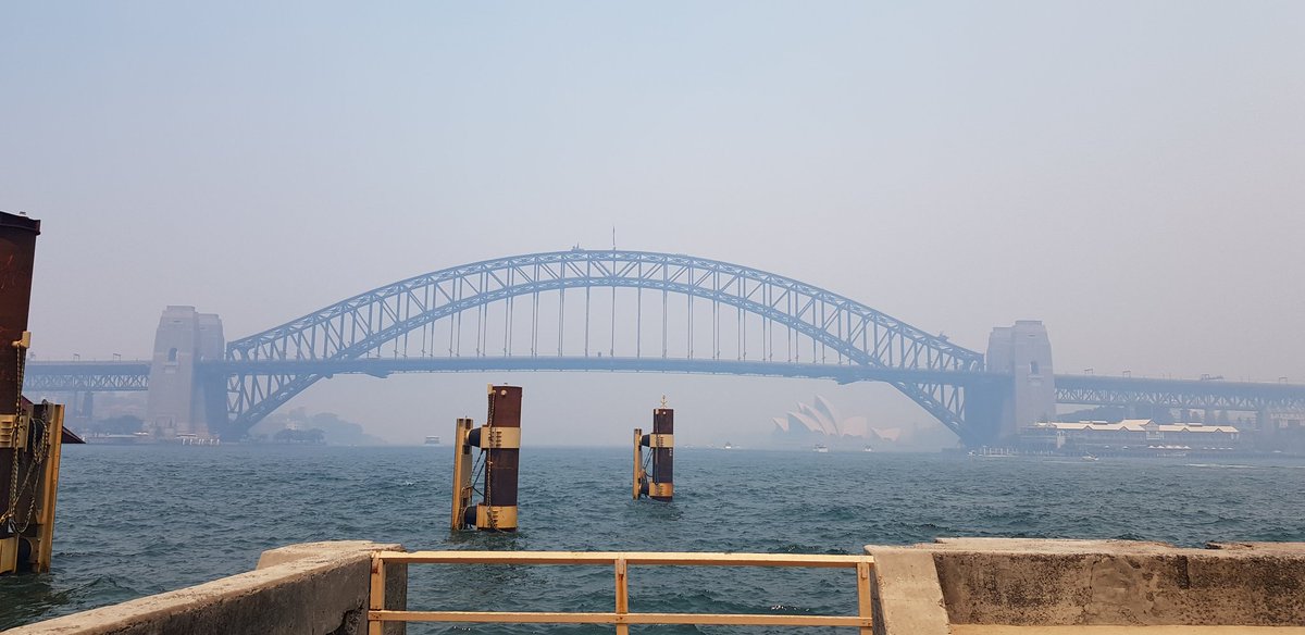 #sydneyharbourbridge and #sydneyoperahouse taken from #milsonspoint, #mcmahonspoint and #bluespoint c. 2pm. #sydneysmoke is choking and I'm feeling so scared by this. Can my kids play outside at all anymore without having asthma attacks?