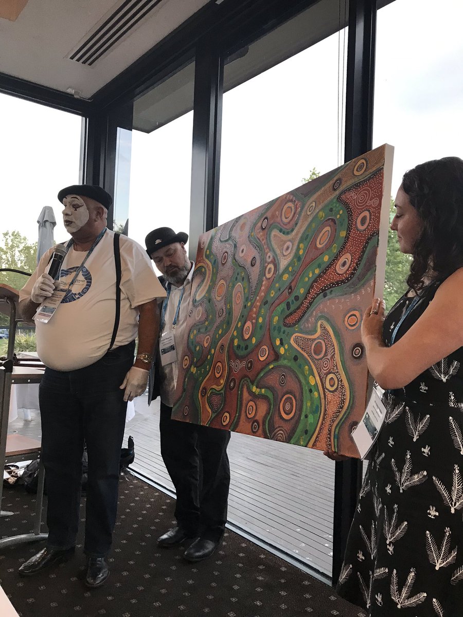 waterpenny10's tweet photo. Phil Duncan (aka Marcel Marceau) announcing the award of this wonderful painting to conference organiser Rebecca Lester at last night’s AFSS/NZFSS dinner #AFSS2019 https://t.co/Tt4ZDwWHY6