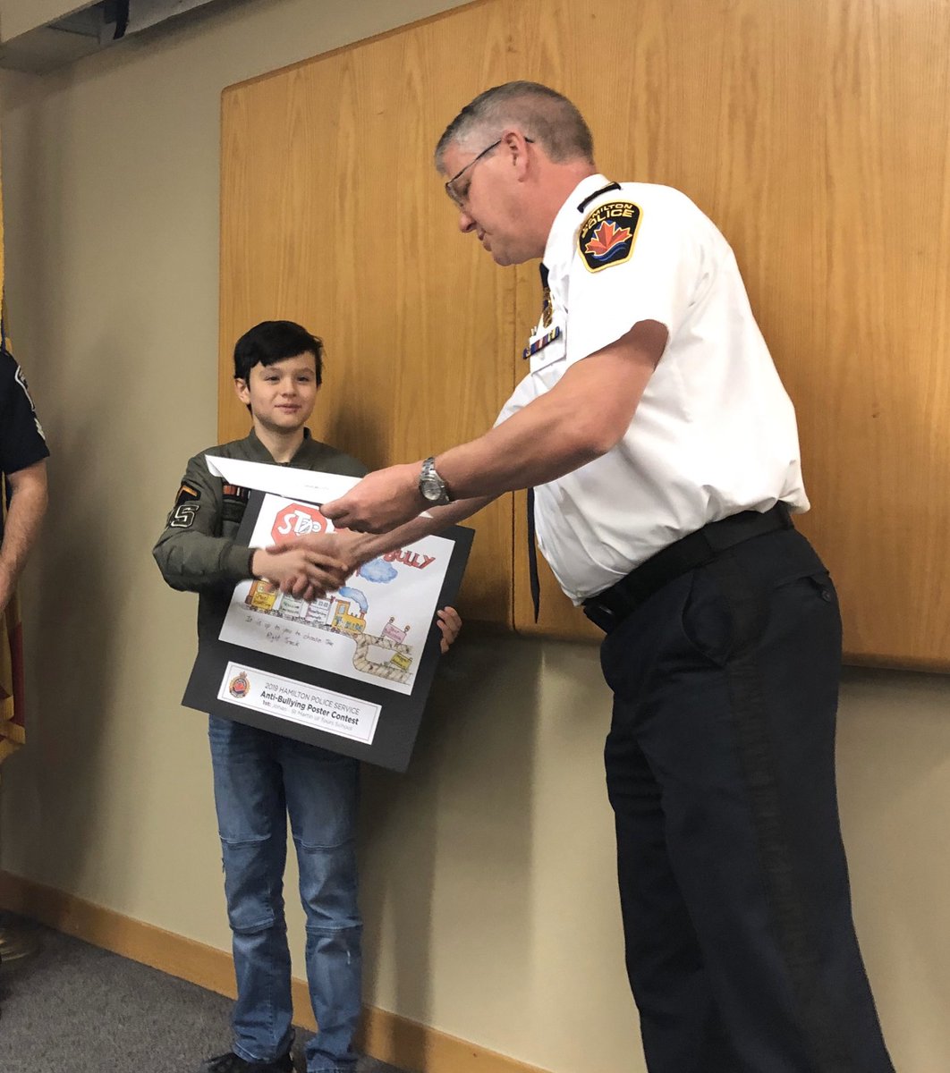 HPSCrimePrevent's tweet photo. Congrats to our #CPweek2019 poster contest winner Johan. His #antibullying poster was selected from 600 entries across #HamOnt. Thk U Chief Girt, D/C Bergen, D/C @Dio801 & CAO Filice for recognizing his work ๐จ today. @HamiltonPolice @HWCDSB https://t.co/AUvSIP4VSg