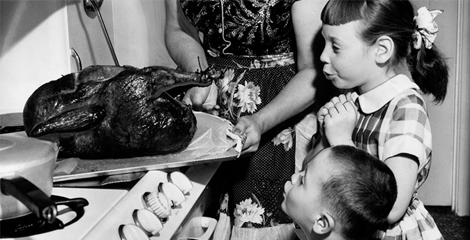 children looking at cooked turkey