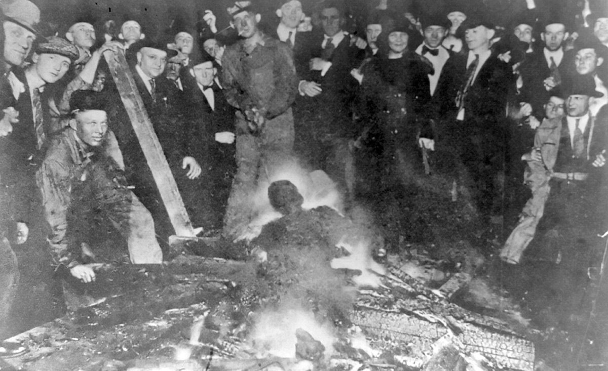 85) The mob shot Brown to death when it cornered him inside the prison, then toyed with his corpse in its usual gruesome fashion: dangled from a telephone post, shot to pieces, then tied to the rear end of a car and dragged through the streets, then tossed onto a bonfire.