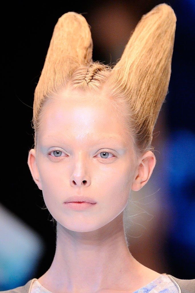MAKEUP: The models were given this androgynous appearance through the cancellation of their eyebrows, and their pale and waxy skin. As the sections of the colelction shifted, the contours of their faces began to distort with prosthetic enhancement.