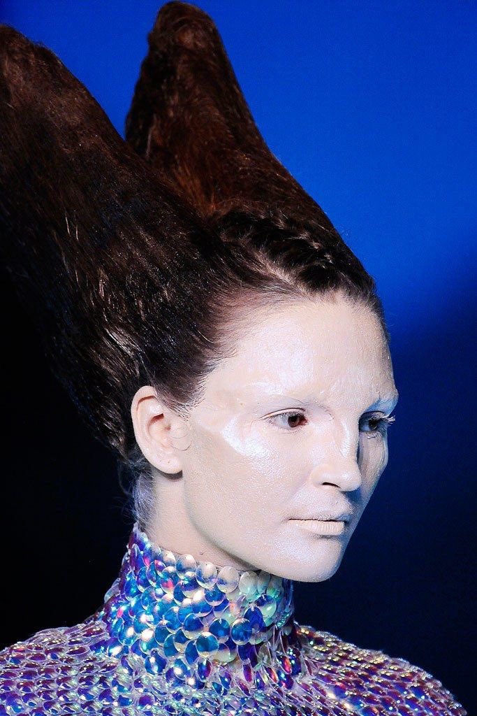 MAKEUP: The models were given this androgynous appearance through the cancellation of their eyebrows, and their pale and waxy skin. As the sections of the colelction shifted, the contours of their faces began to distort with prosthetic enhancement.
