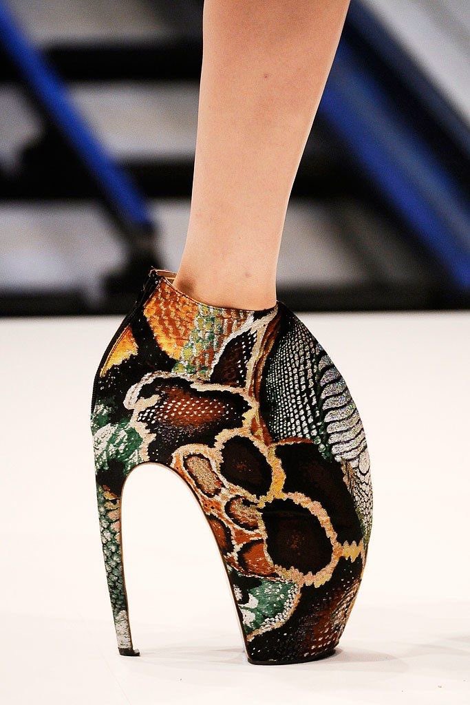 THE SHOES: We had three types of shoes in this collection, all 3D-printed contraptions. The most notable one is what were later called, "Armadillo Shoes", which sort of enveloped the models' legs like the gnarly mouth of a monster.