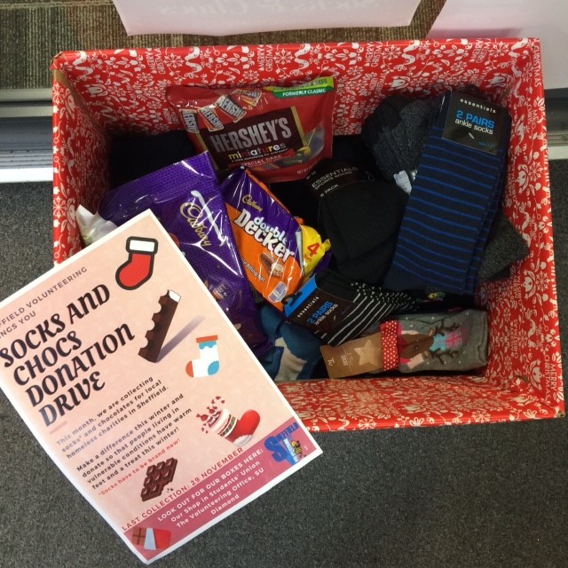 Shef_Volunteer's tweet photo. We are collecting Socks and Chocs for local homeless charities. Last day tomorrow so please bring us your (new) socks and any chocolates and drop them in the box by the door of our Volunteering Office. x #4weeksofaction @helpushelpsheff @SheffieldSU @SheffieldSUPres https://t.co/rzQMQxetU3