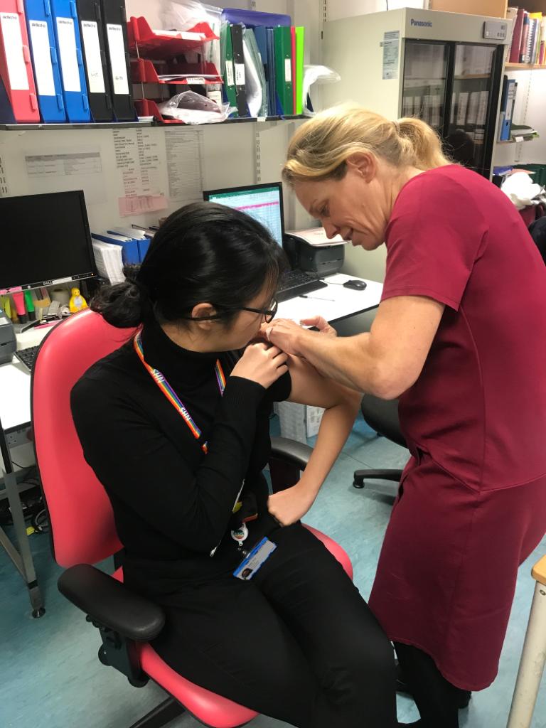 Protecting #patients as a #flufighter. Thanks @katepineSTEP for coming to #asepticservices to #vaccinate us!