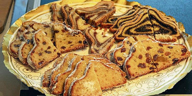 candied peel and covered generously in confectioner's sugar. Other varieties are the poopy seed Stollen (sometimes with a streusel topping), Quarkstollen, Marzipanstollen, almond Stollen, nut Stollen and Butterstollen