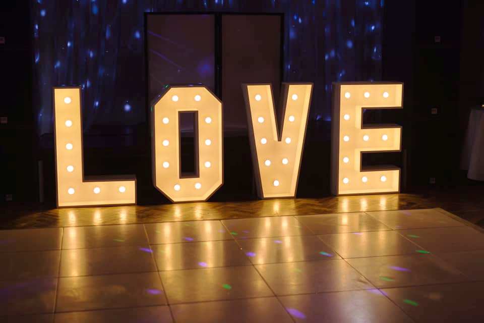 Illuminated L.O.V.E Letters are a big hit at wedding events and we stock the design shown in this photo, here they are being used at a recent wedding party in Oxfordshire.

We offer different colour lamps if required or warm white as shown standard.