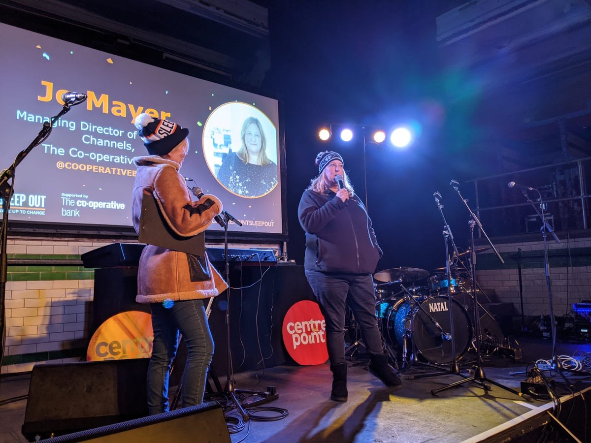 CooperativeBank's tweet photo. Jo Mayer, Managing Director of Customer Channels The Co-operative Bank, is joined on stage by @thelisamaxwell & @centrepointuk’s @OrlaConstant to welcome everybody to #SleepOutMCR. #CentrepointSleepOut https://t.co/pHsGGCT284