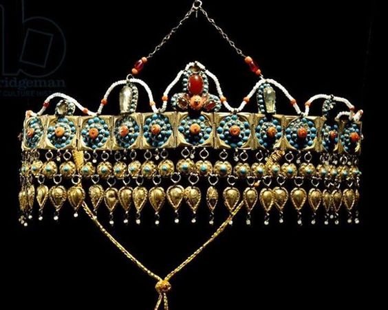 Uzbekistan: crown of silver-gilt, coral, turquoise and glass paste from Samarkand.