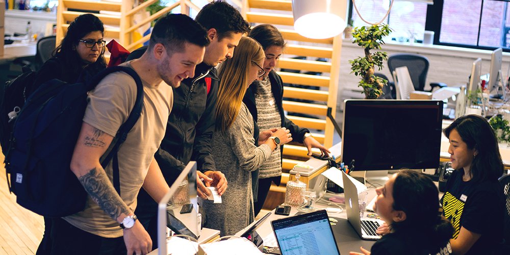 A few attendees registering at the front desk of the Shopify office for our first Design Systems Community meetup.