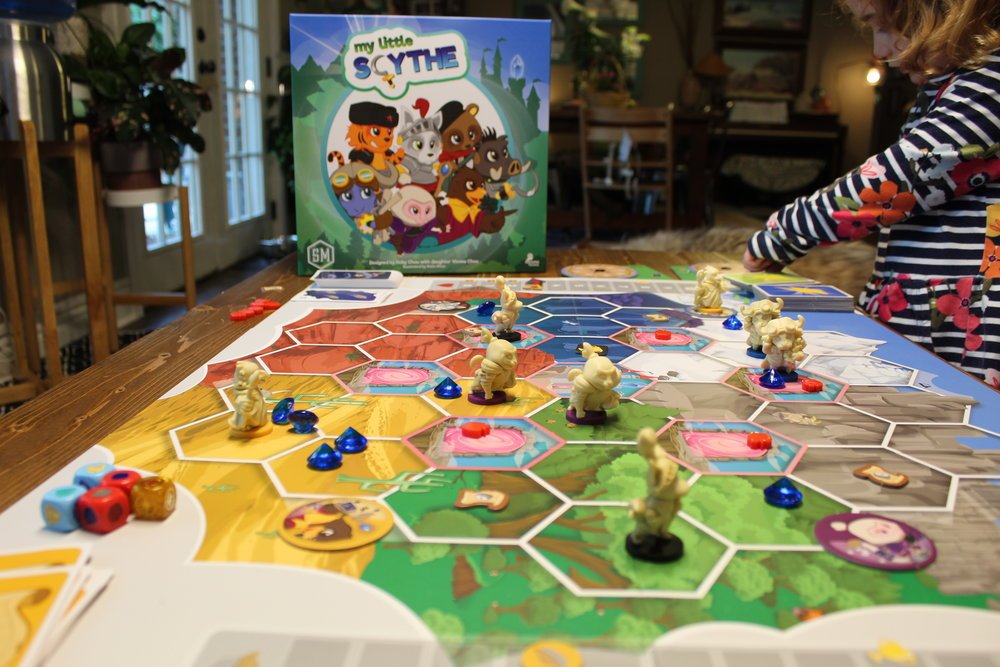 My Little Scythe is a kid-friendly version of the rather dry looking Scythe (Scythe looks like a big ol war game but it's just a game about being popular). The theme-change was a stroke of genius.