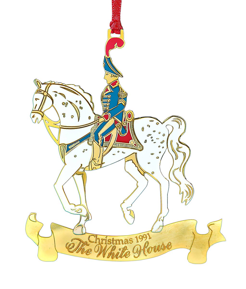 The 1991 ornament honors President William Henry Harrison. The president is depicted riding his white charger on the way to the Capitol to take the presidential oath of office. Harrison would pass away one month after his inauguration. https://shop.whitehousehistory.org/holidays/ornaments/1990-1993-four-white-hour-ornaments-sold-as-a-set