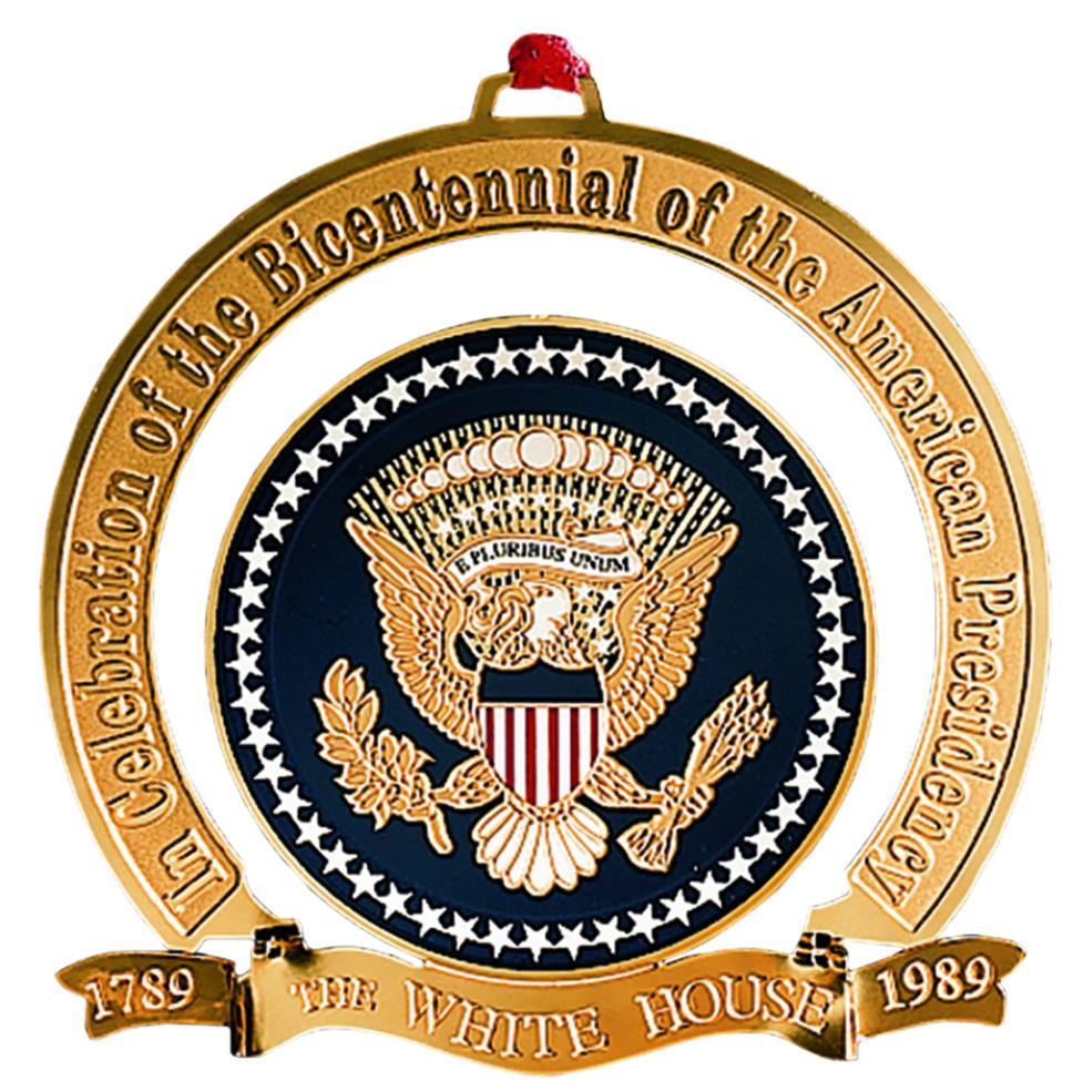 The White House Christmas Ornament for 1989 celebrates the 200th anniversary of the Presidency of the United States with a replica of the official seal of the president.Purchase one for your house:  https://shop.whitehousehistory.org/holidays/ornaments/1989-white-hour-ornament-celebrating-the-bicentennial-of-the-presidency-1789-1989