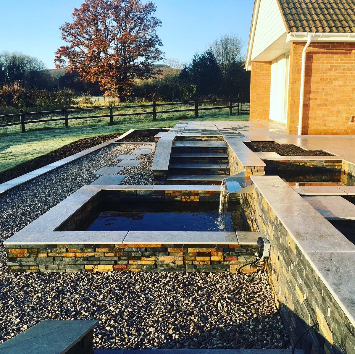 LtdAveryLand's tweet image. A sight for sore eyes yesterday morning after all the recent rain and dull weather!                                          Just the finishing touches to this project now before planting it up in the Spring. #averylandscapesltd #slatecladding #porcelainpaving  #garden